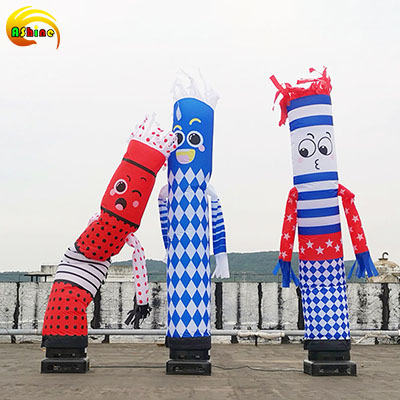 Cartoon inflatable dancers with a quirky temperament wave and dance to people Cartoon inflatable dancers with a quirky temperament wave and dance to people